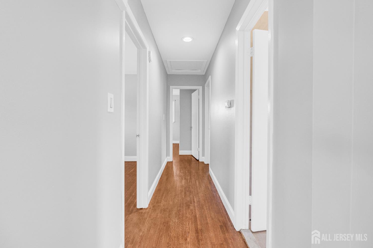 6 Marc Court Edison, NJ 08820 - Photo 16 of 42 a view of a hallway with wooden floor and closet