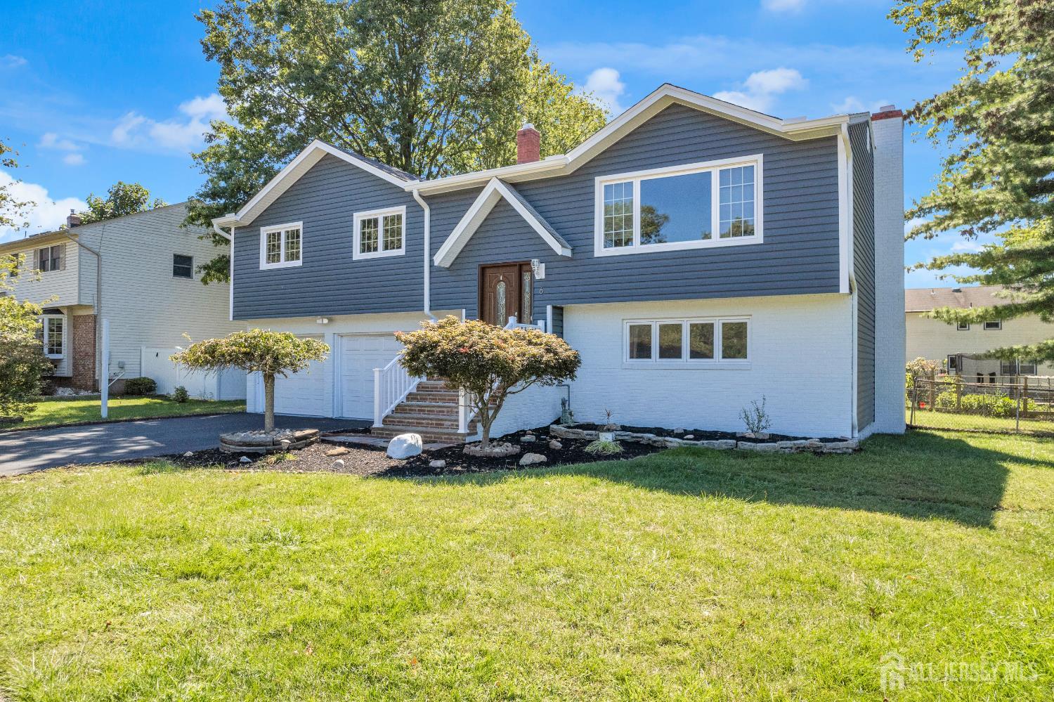 6 Marc Court Edison, NJ 08820 - Photo 2 of 42 a front view of a house with a yard