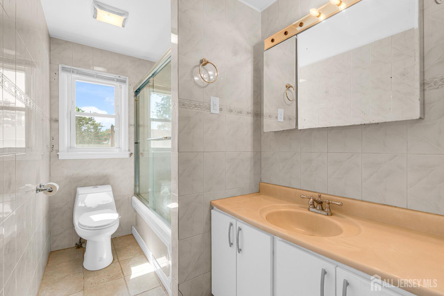 6 Marc Court Edison, NJ 08820 - Photo 25 of 42 a bathroom with a sink and a toilet