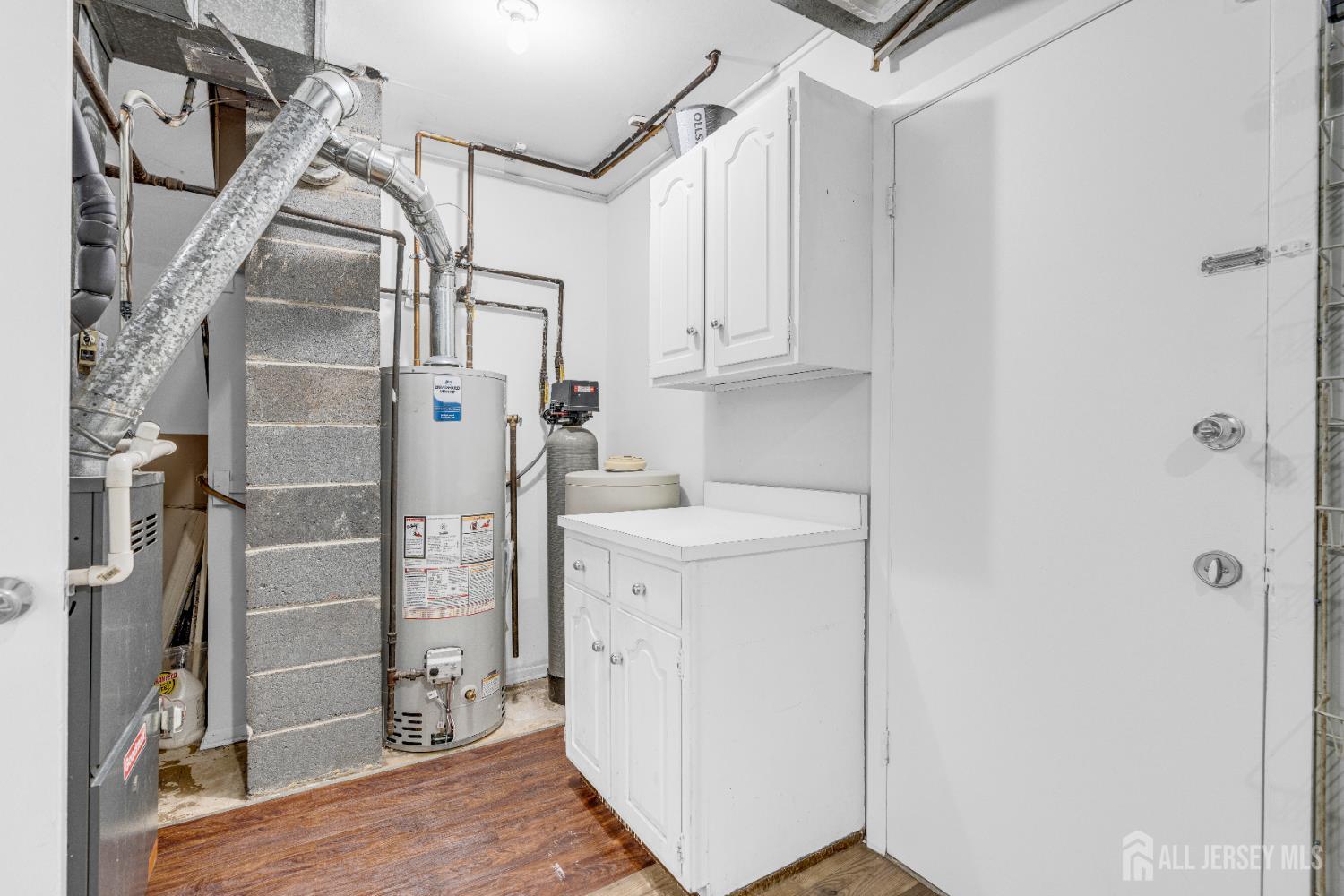 6 Marc Court Edison, NJ 08820 - Photo 32 of 42 a view of a storage & utility room with closet dryer