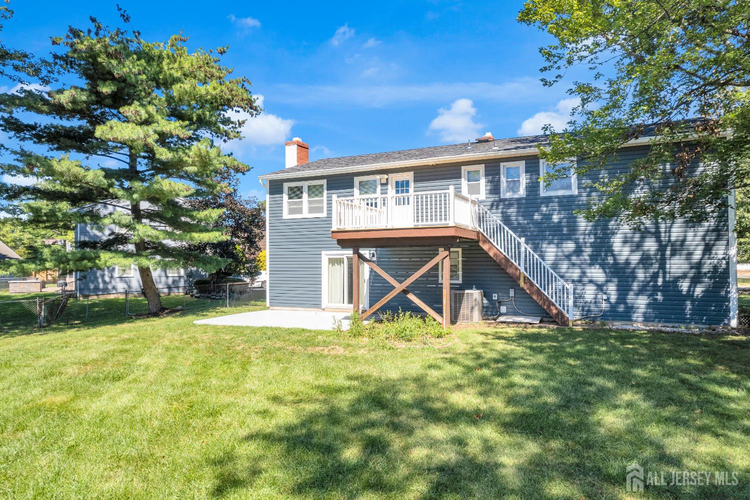 6 Marc Court Edison, NJ 08820 - Photo 36 of 42 a view of house with a big yard and potted plants