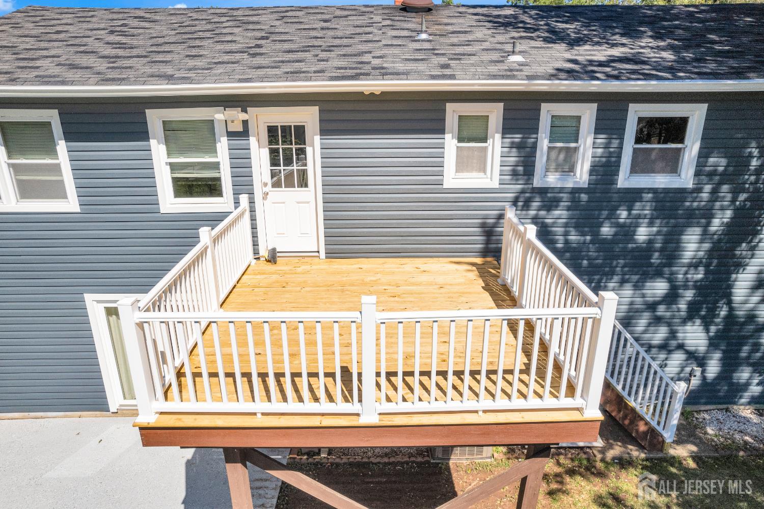 6 Marc Court Edison, NJ 08820 - Photo 40 of 42 a view of a house with a wooden deck
