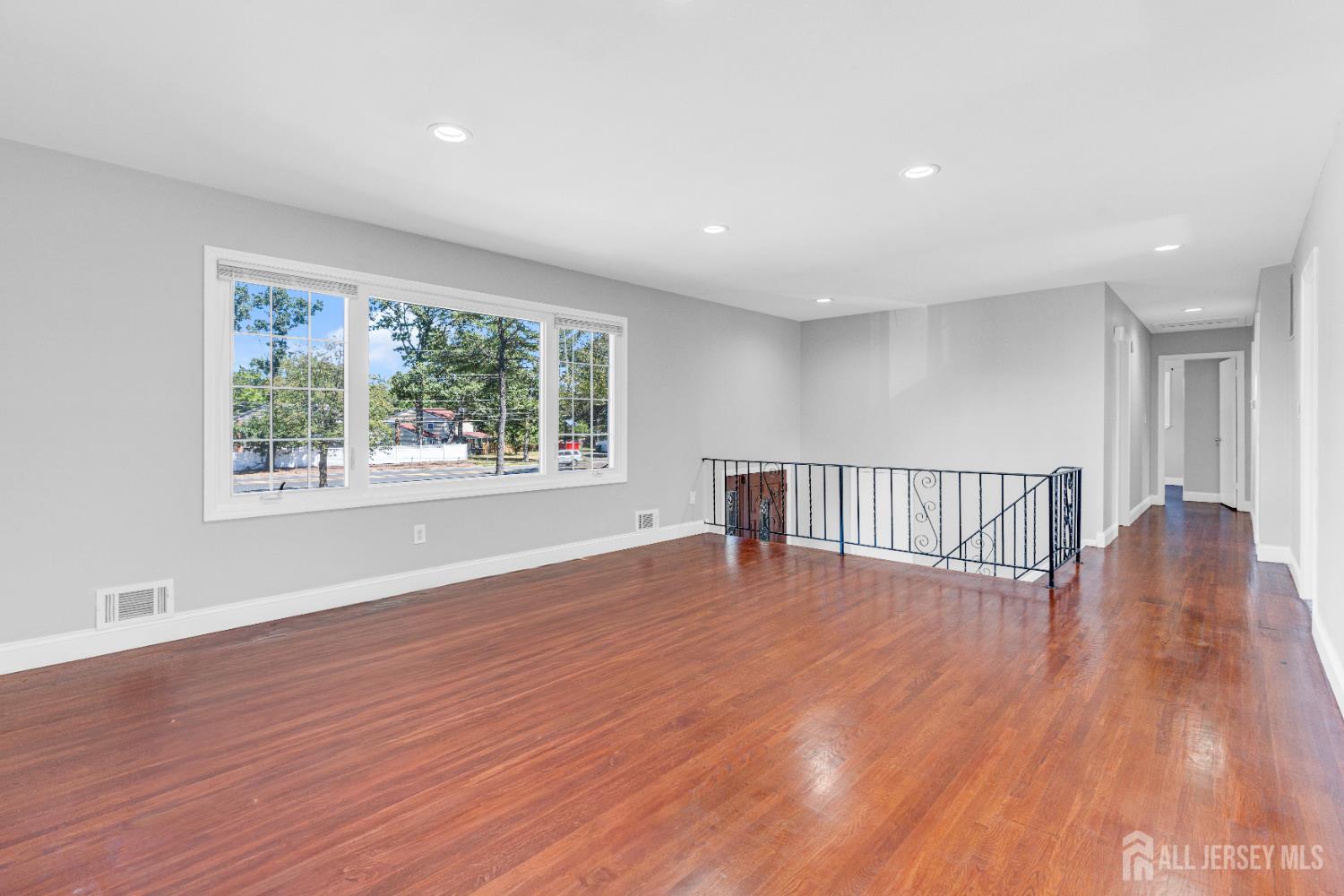 6 Marc Court Edison, NJ 08820 - Photo 7 of 42 a view of a room with wooden floor and windows