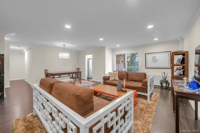 a living room with furniture a couch and a flat screen tv