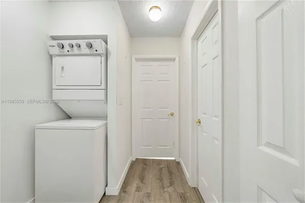 a view of hallway with washer and dryer
