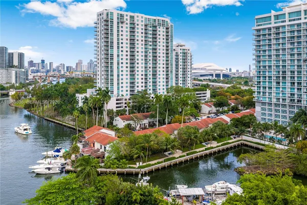 a view of a lake with a city skyline in the background