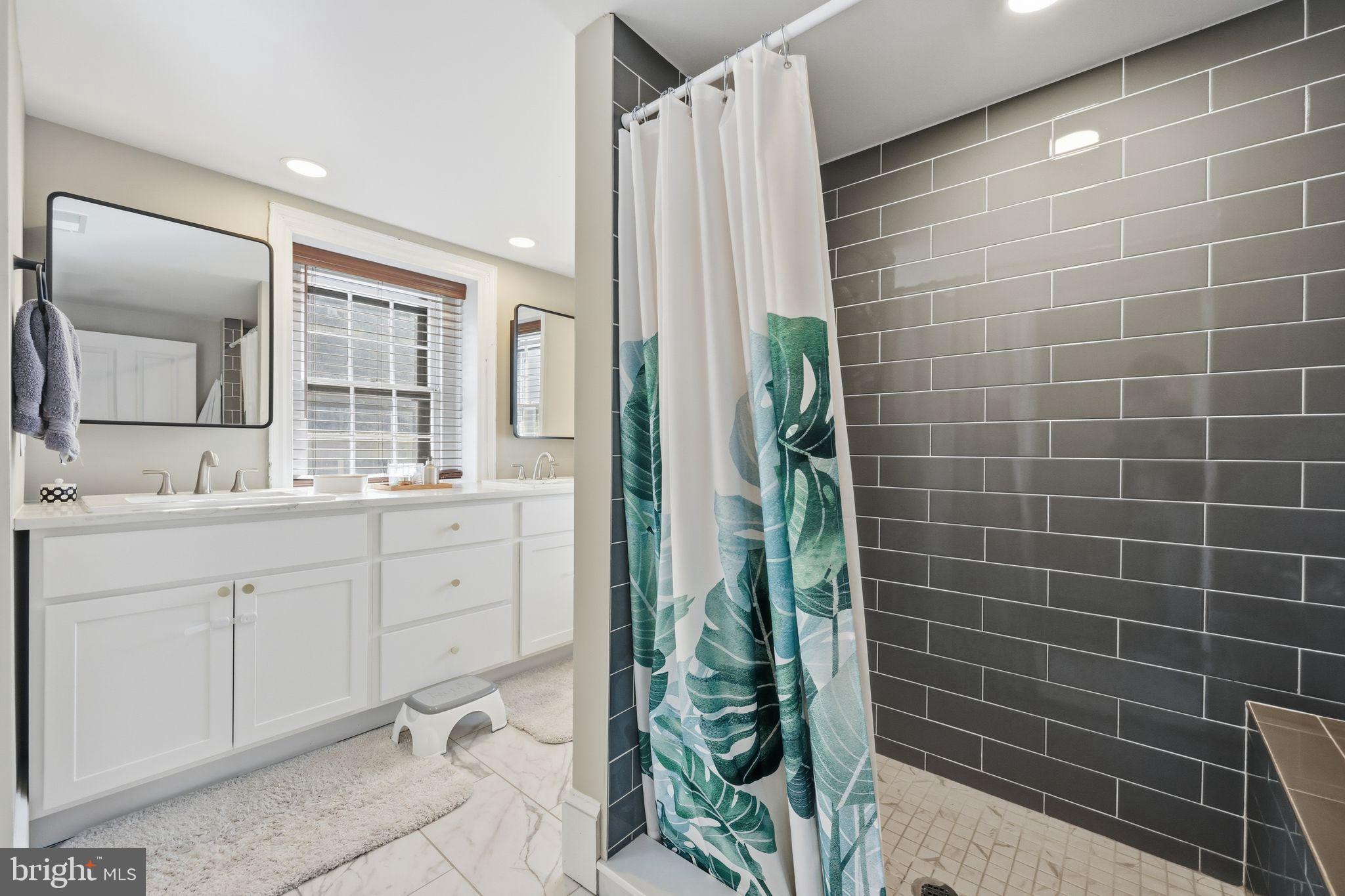 126 North Providence Road Media, PA 19063 - Photo 14 of 28 a bathroom with a double vanity sink and a mirror