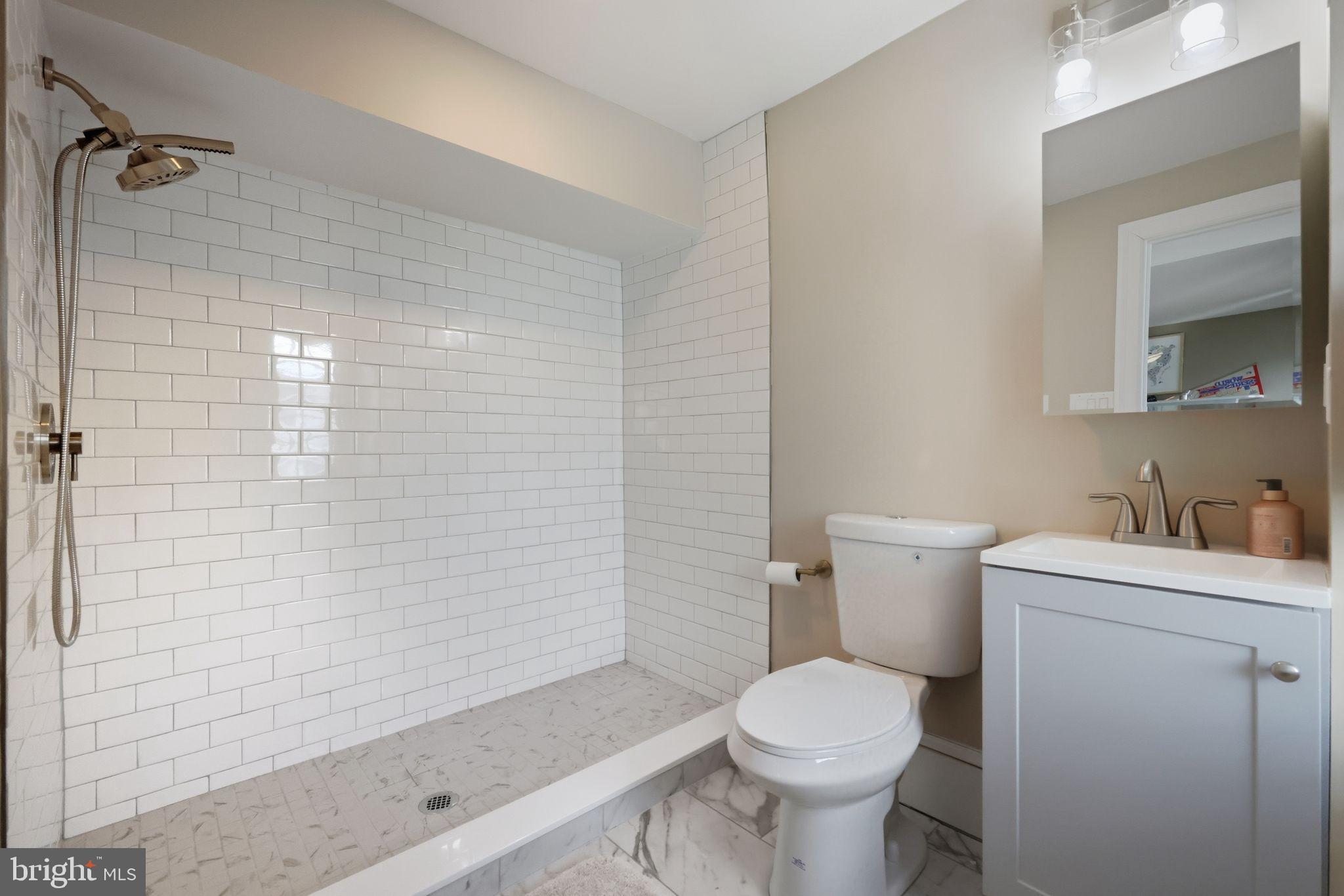 126 North Providence Road Media, PA 19063 - Photo 16 of 28 a bathroom with a sink a toilet and shower