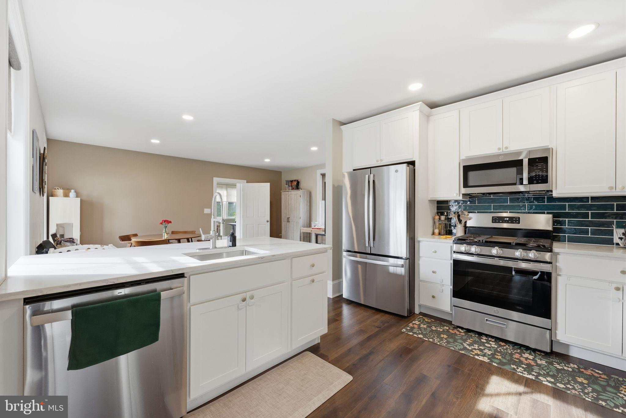 126 North Providence Road Media, PA 19063 - Photo 3 of 28 a kitchen with a sink stove and refrigerator