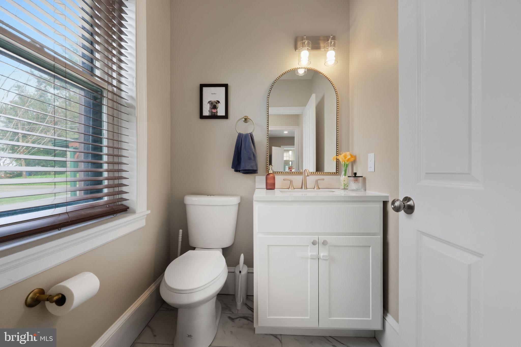 126 North Providence Road Media, PA 19063 - Photo 7 of 28 a bathroom with a toilet sink and mirror