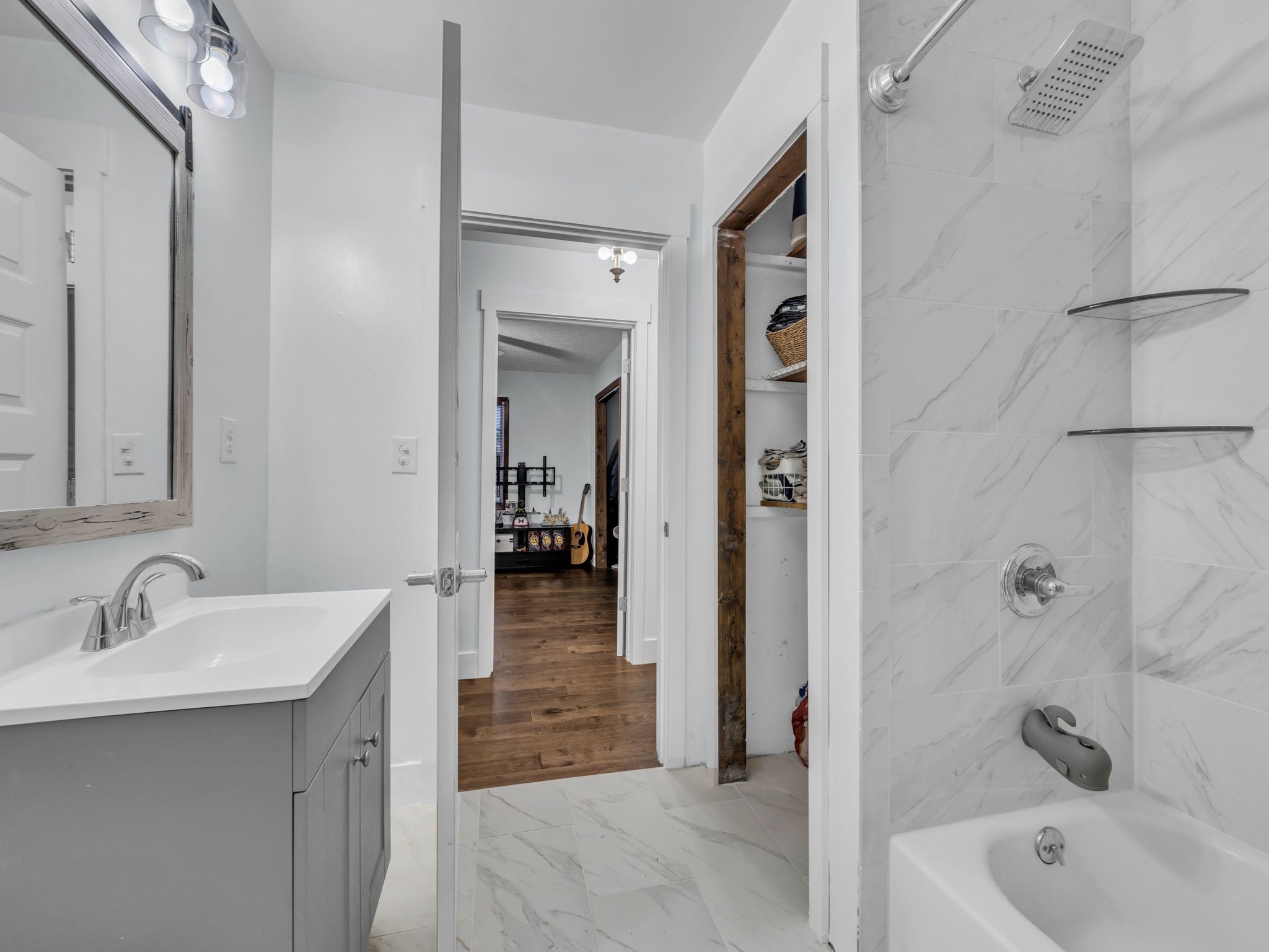 4055 Erin Road McEwen, TN 37101 - Photo 14 of 25 a bathroom with a tub sink and mirror