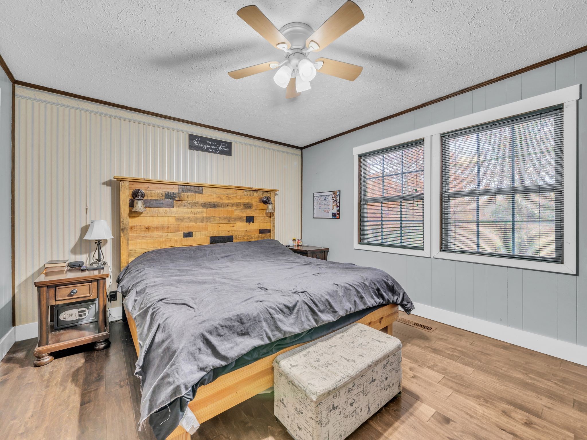 4055 Erin Road McEwen, TN 37101 - Photo 15 of 25 a bedroom with a bed and a chandelier