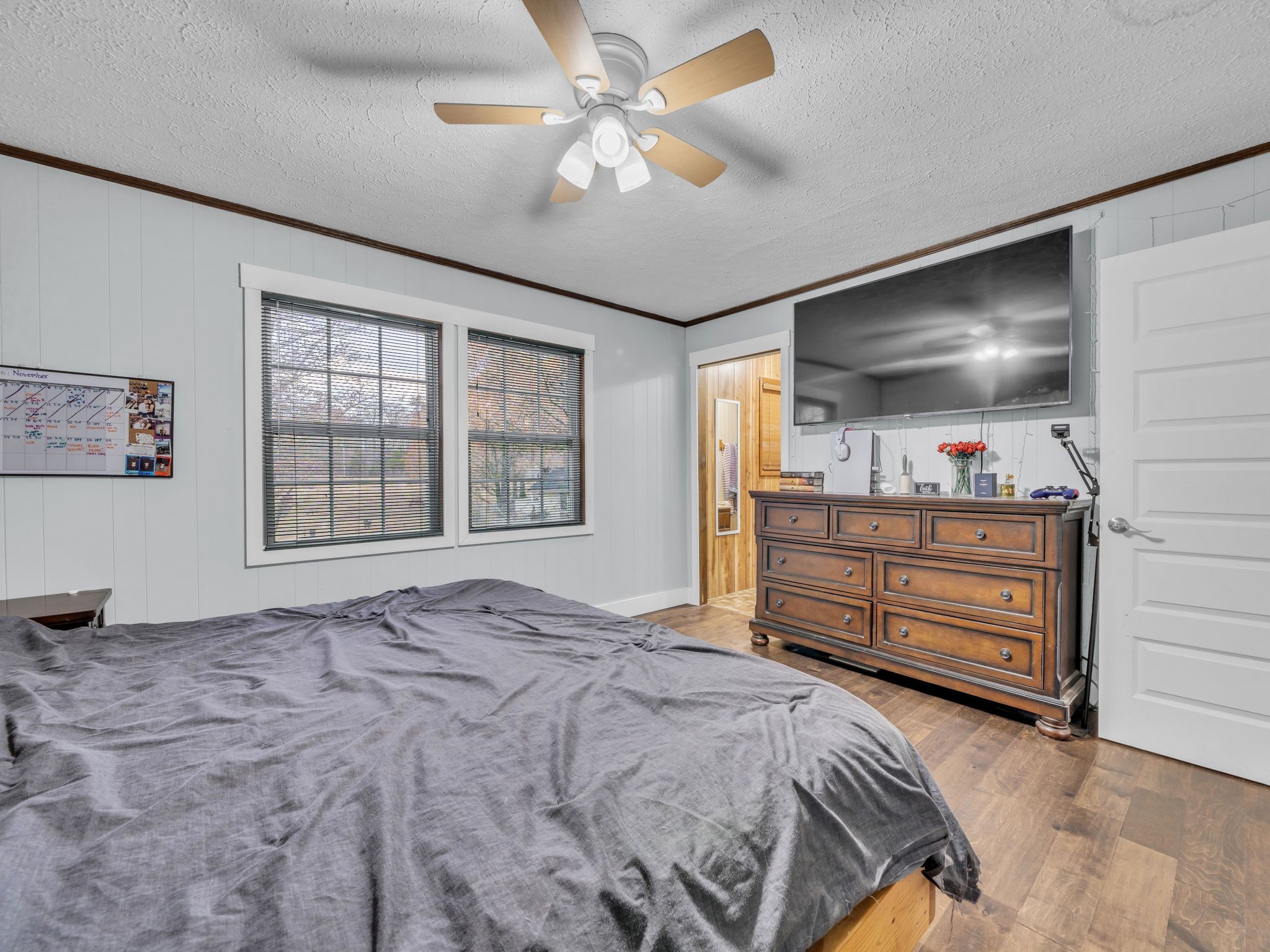 4055 Erin Road McEwen, TN 37101 - Photo 16 of 25 a bedroom with a bed and a chandelier