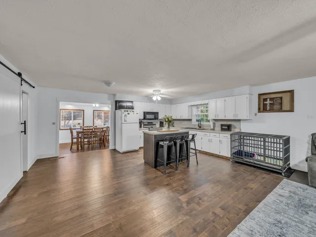 a kitchen with furniture and cabinets