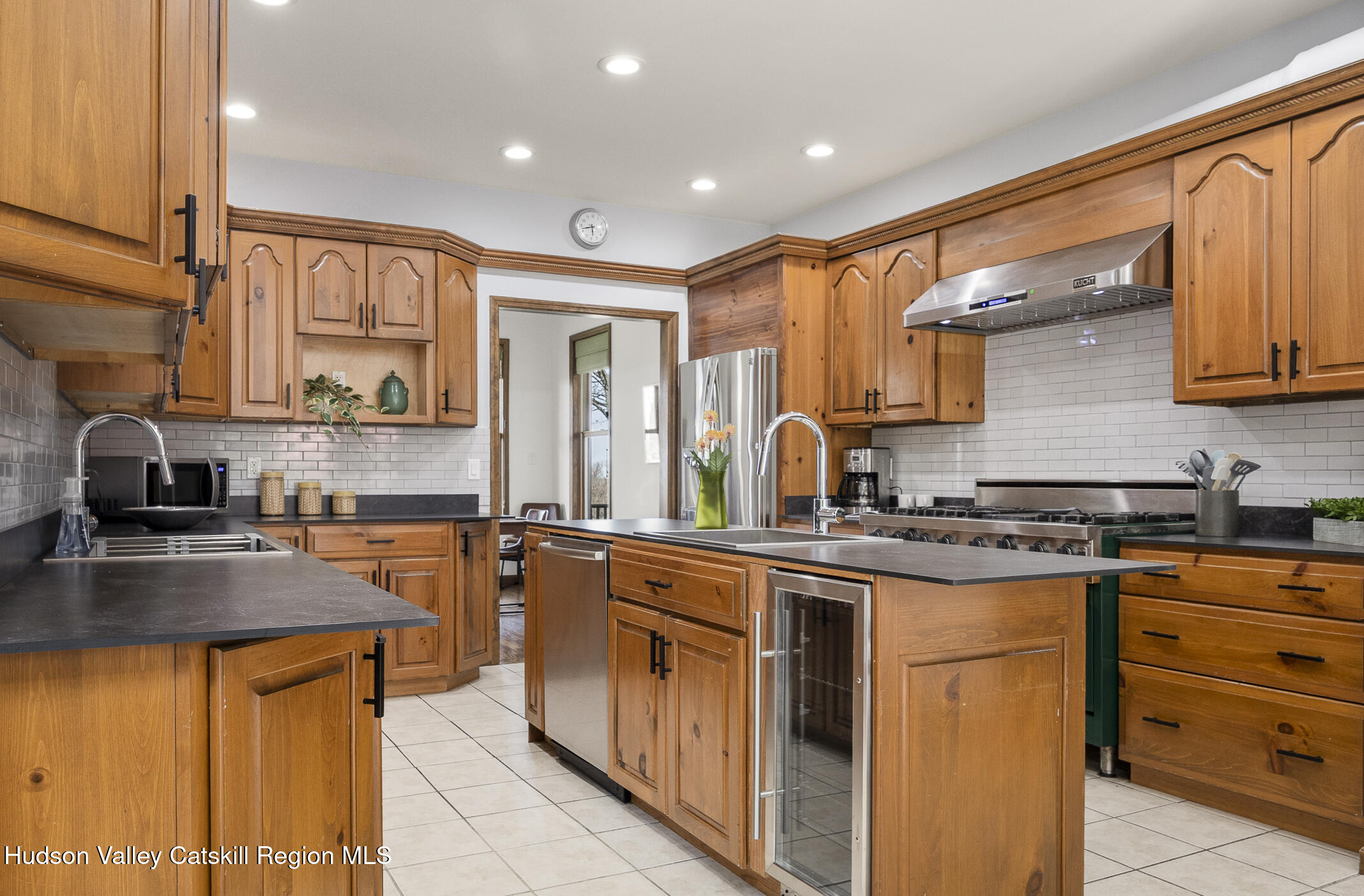 350 Taghkanic Road Elizaville, NY 12523 - Photo 12 of 36 a kitchen with stainless steel appliances granite countertop wooden cabinets sink and a granite counter top