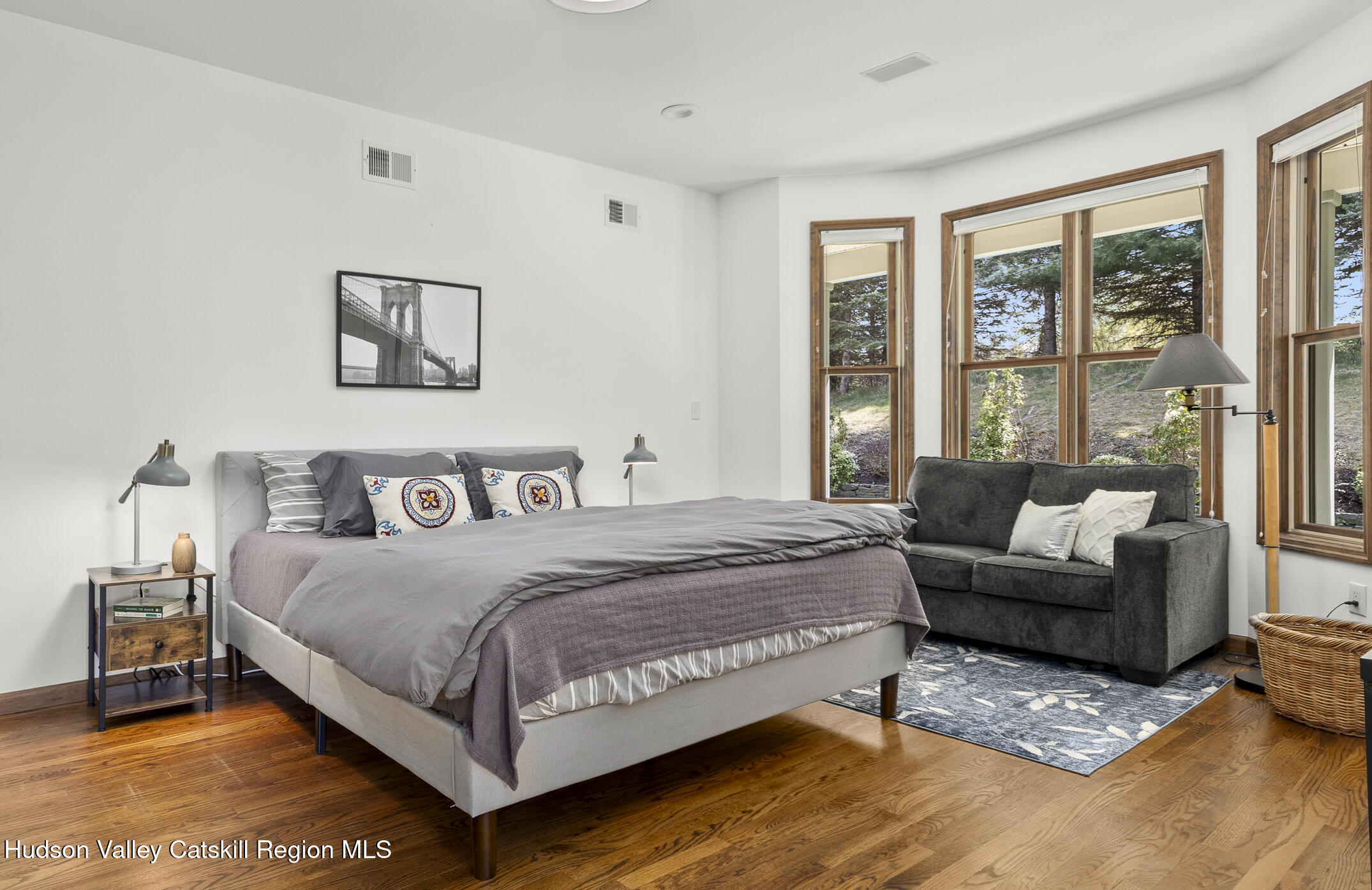 350 Taghkanic Road Elizaville, NY 12523 - Photo 16 of 36 a bedroom with a bed couch and a large window