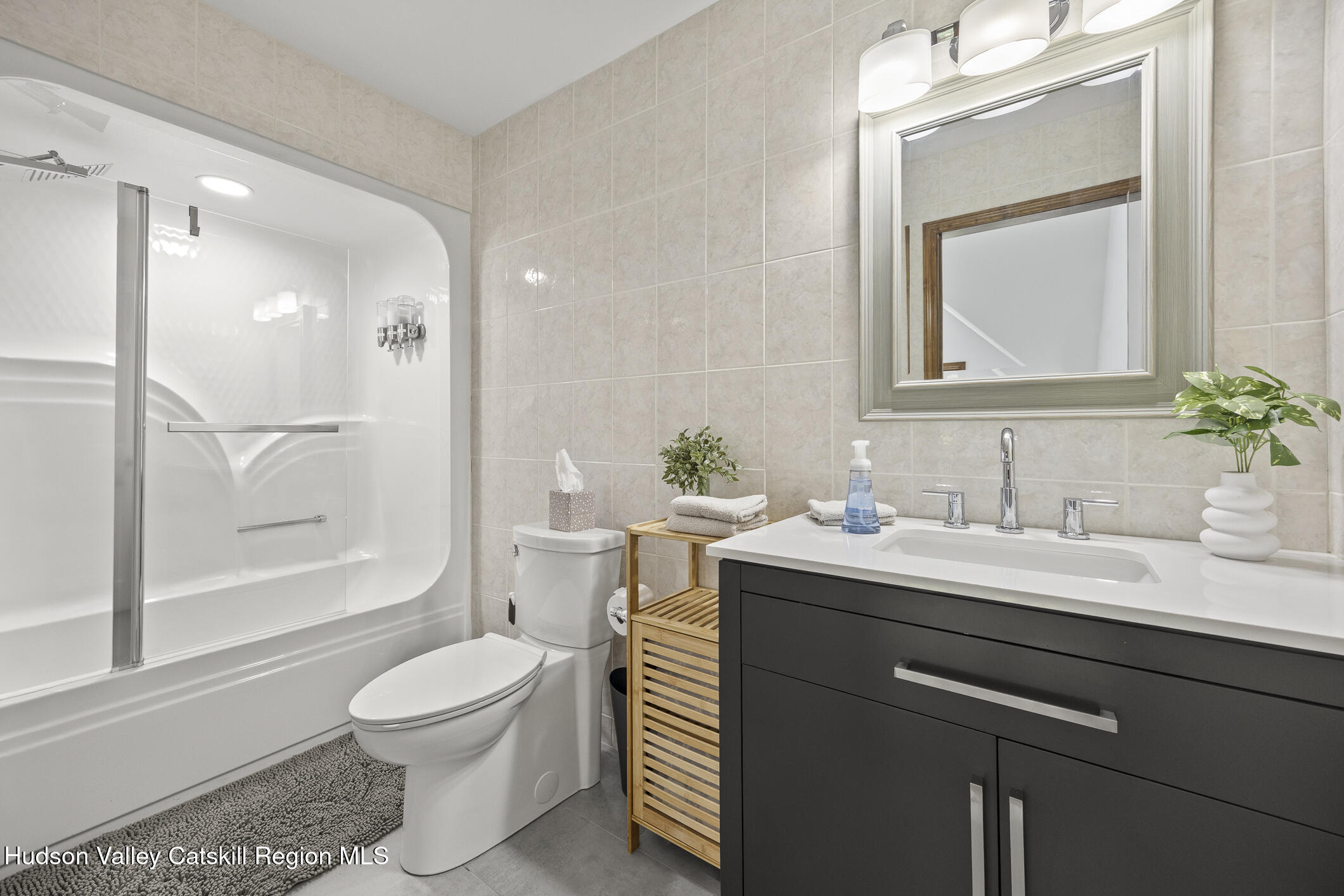 350 Taghkanic Road Elizaville, NY 12523 - Photo 26 of 36 a bathroom with a granite countertop sink mirror vanity and toilet
