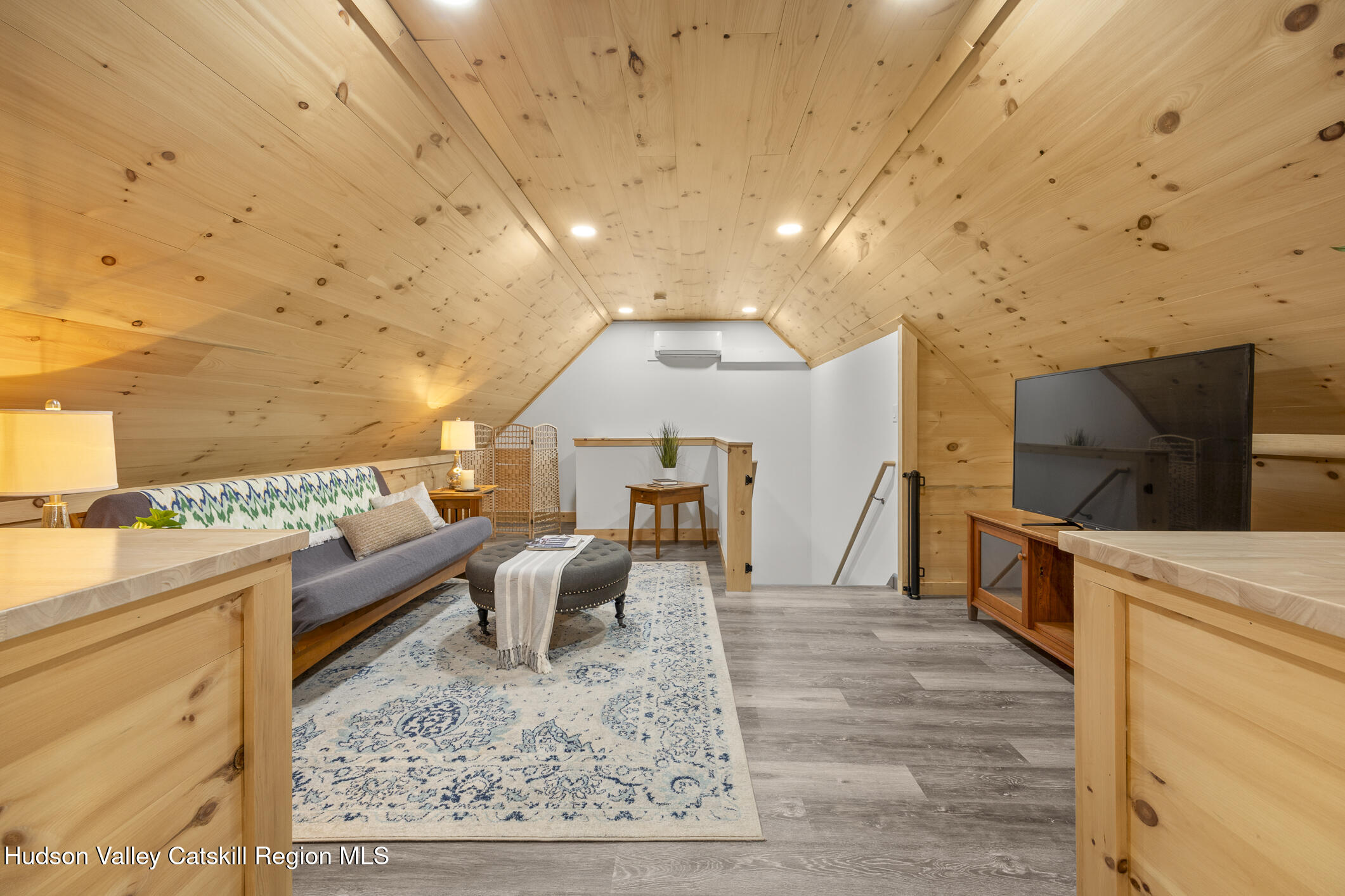 350 Taghkanic Road Elizaville, NY 12523 - Photo 27 of 36 a living room with furniture and a flat screen tv