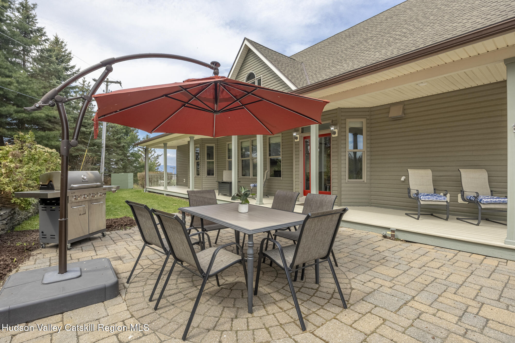 350 Taghkanic Road Elizaville, NY 12523 - Photo 35 of 36 a view of a patio with a table and chairs under an umbrella