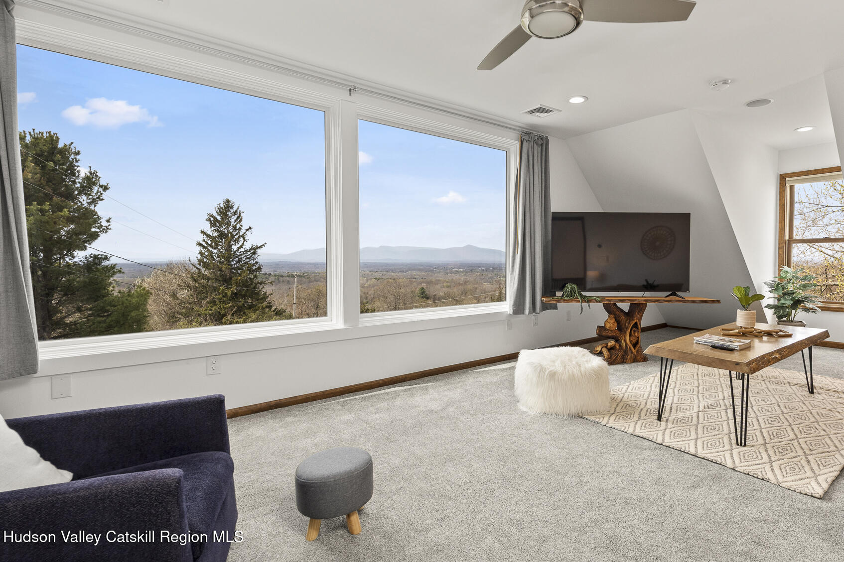 350 Taghkanic Road Elizaville, NY 12523 - Photo 4 of 36 a living room with furniture and a large window