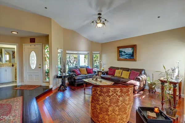 a view of a dining room with furniture window and outside view