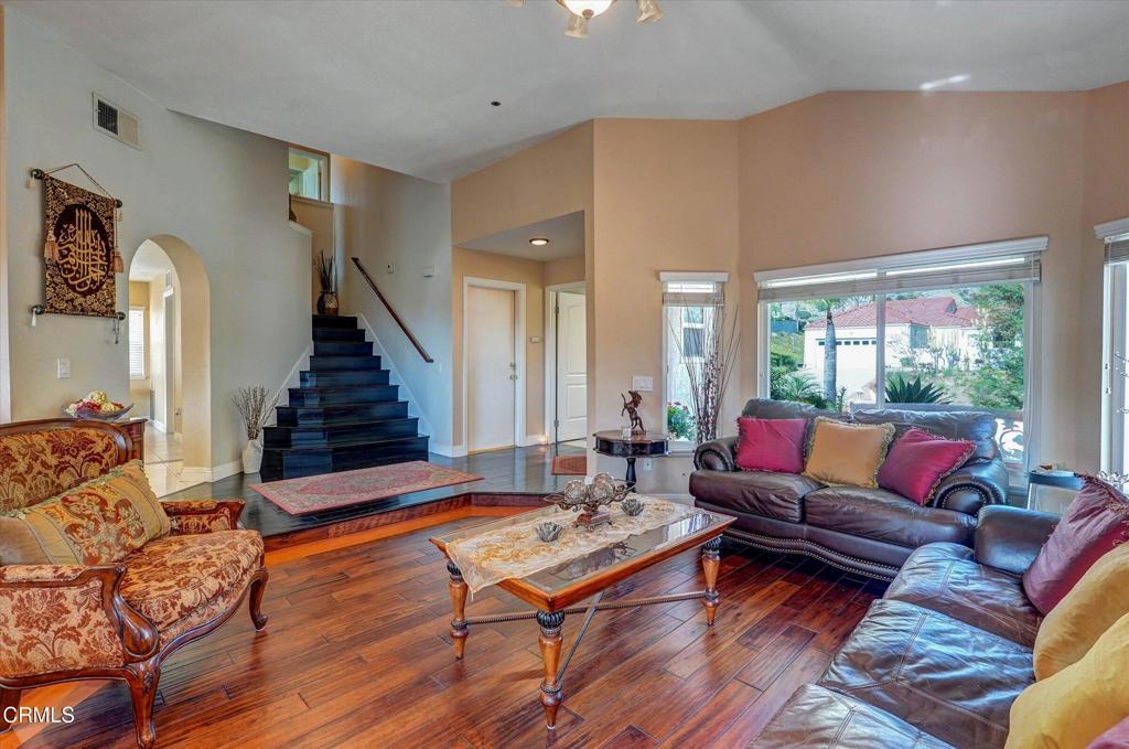 12477 Rajah Street Los Angeles, CA 91342 - Photo 13 of 34 a living room with furniture and a fireplace