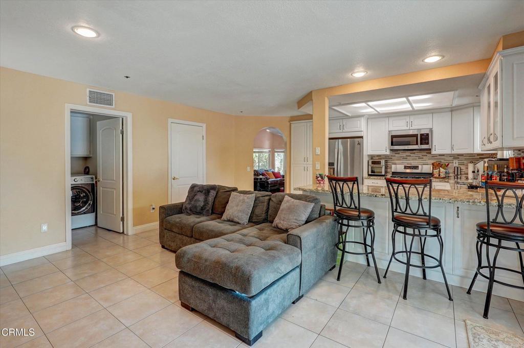 12477 Rajah Street Los Angeles, CA 91342 - Photo 19 of 34 a living room with furniture and kitchen view