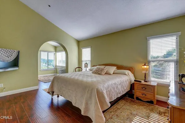 a bedroom with a bed and a dresser