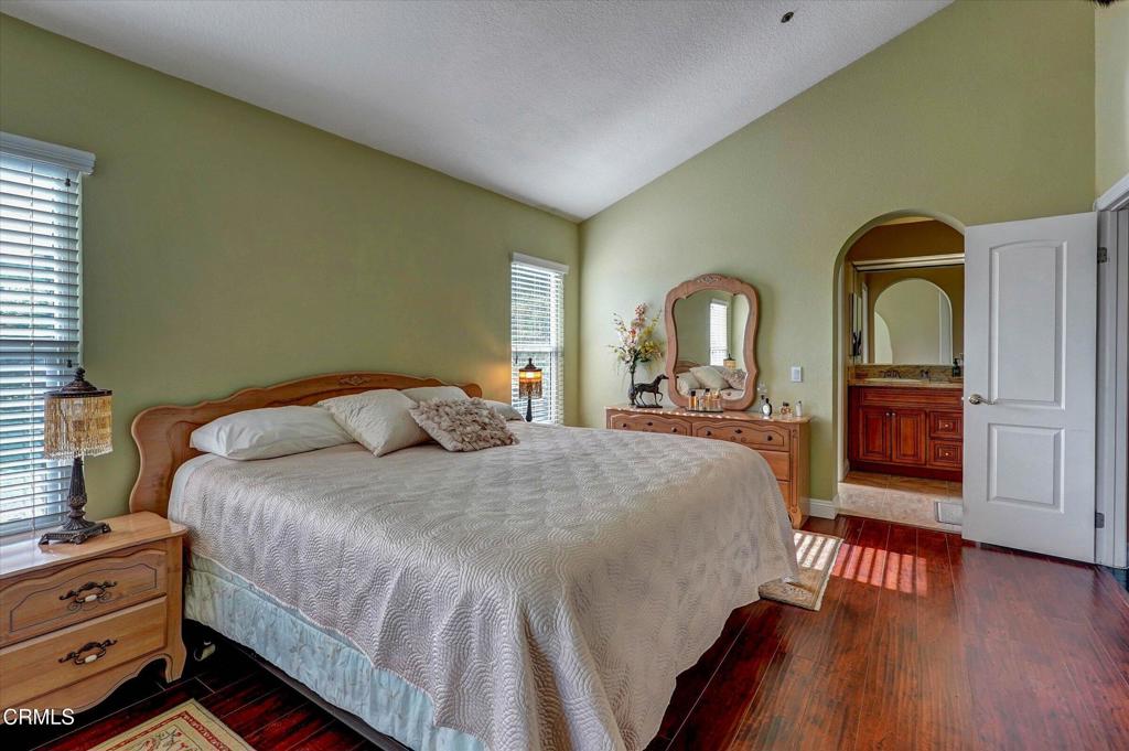 12477 Rajah Street Los Angeles, CA 91342 - Photo 22 of 34 a bedroom with a bed and a dresser