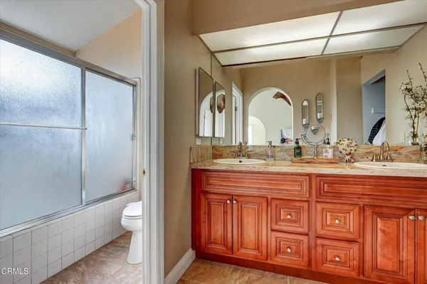 a view of hallway with wooden floor