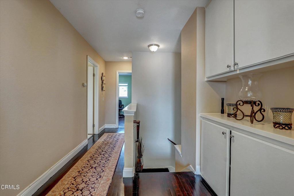 12477 Rajah Street Los Angeles, CA 91342 - Photo 27 of 34 a view of hallway with wooden floor