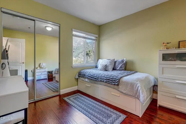 a bedroom with a bed and a table in it