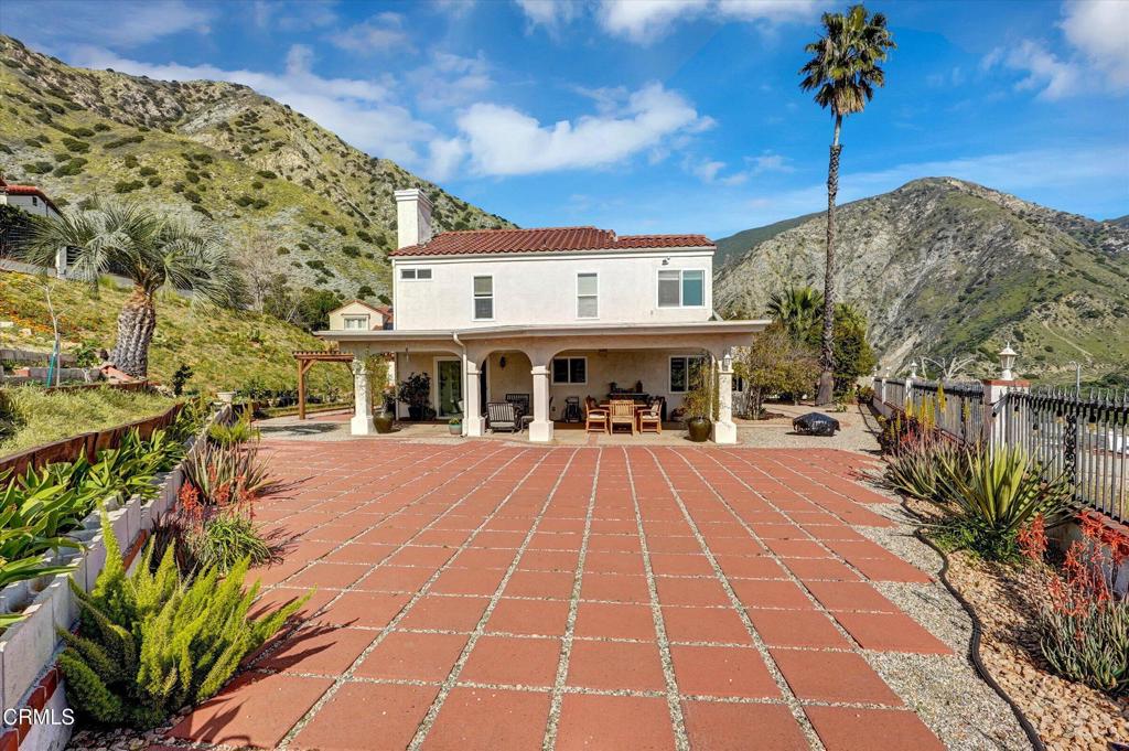 12477 Rajah Street Los Angeles, CA 91342 - Photo 6 of 34 a front view of a building with a garden