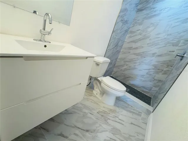 a bathroom with a sink and a toilet