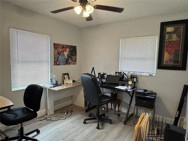 a backyard of a house with table and chairs