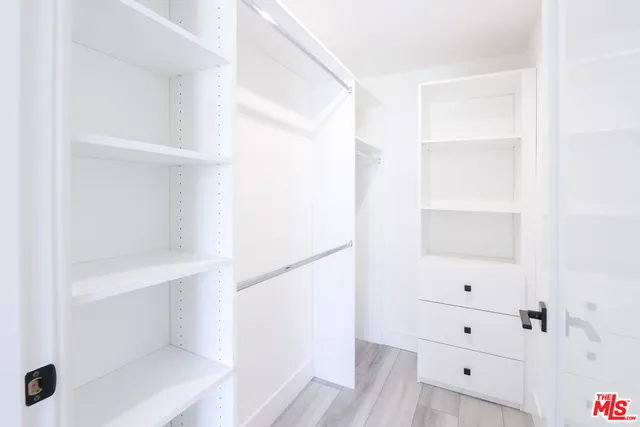 a view of an empty walk in closet