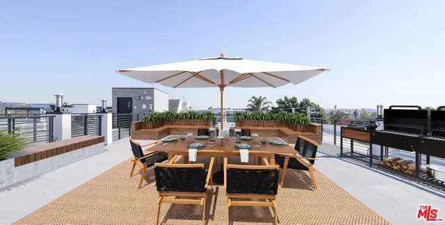 a view of a patio with furniture and table