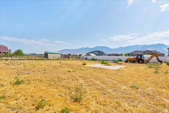 4364 Rose Springs Road Erda, UT 84074 - Photo 26 of 27 View of unfinished yard featuring a mountain view and a patio area
