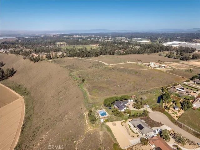an aerial view of a house with a mountain view