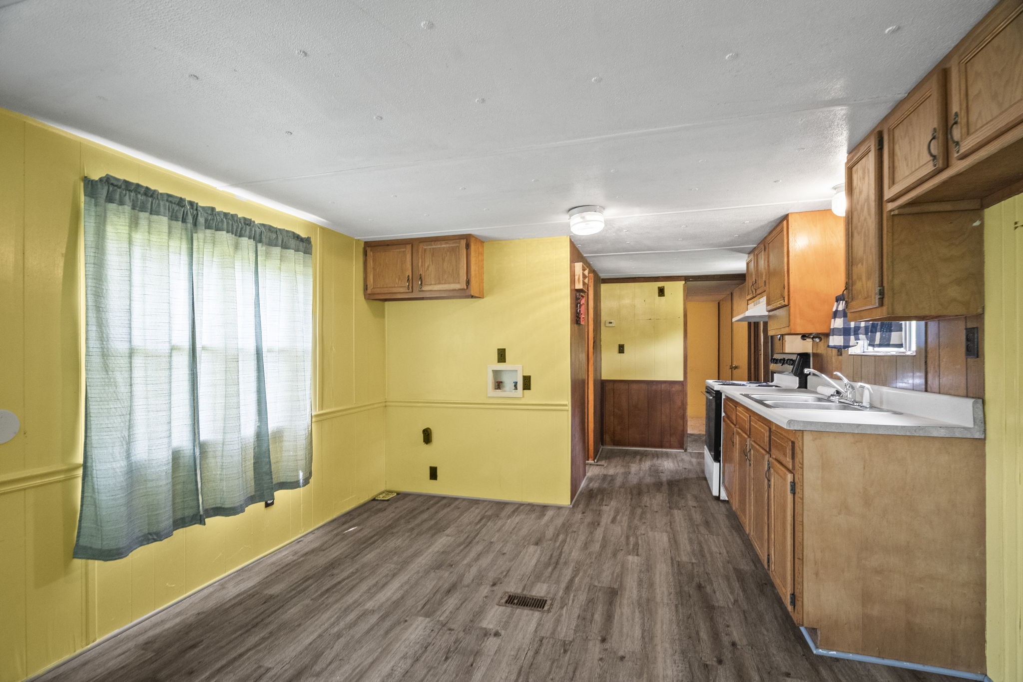 6214 Lincoln Park Road Springfield, TN 37172 - Photo 13 of 25 a large kitchen with a wooden floor and outdoor space
