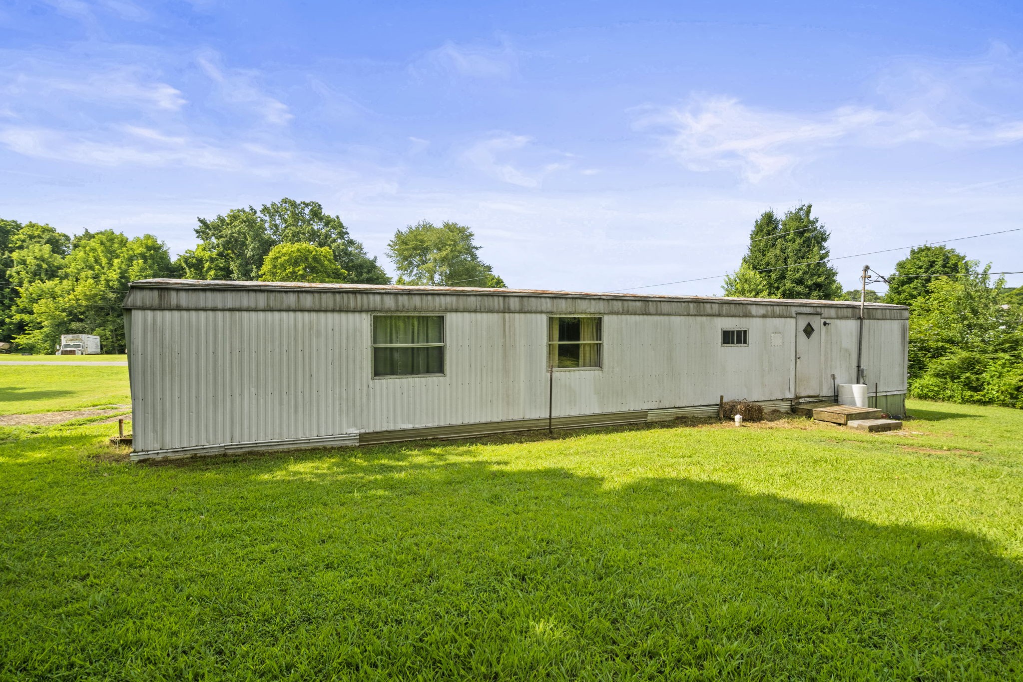6214 Lincoln Park Road Springfield, TN 37172 - Photo 22 of 25 a backyard of a house with plants and wooden fence