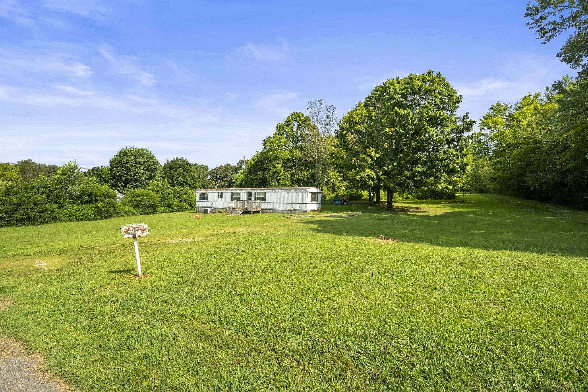 6214 Lincoln Park Road Springfield, TN 37172 - Photo 7 of 25 a garden with trees in the background