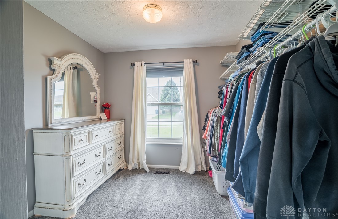1442 Langdon Road Sidney, OH 45365 - Photo 16 of 34 This spacious walk-in closet offers ample storage and natural light.