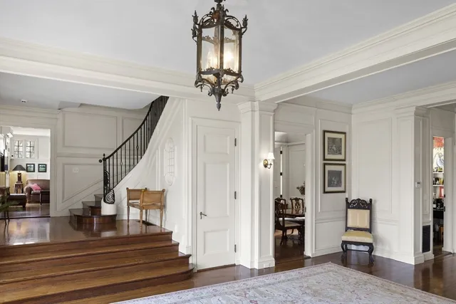 a large kitchen with stainless steel appliances granite countertop a stove a sink a dining table and chairs