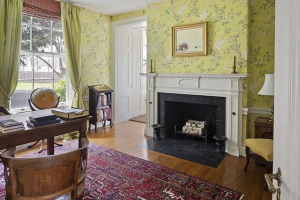 a living room with furniture and a fireplace