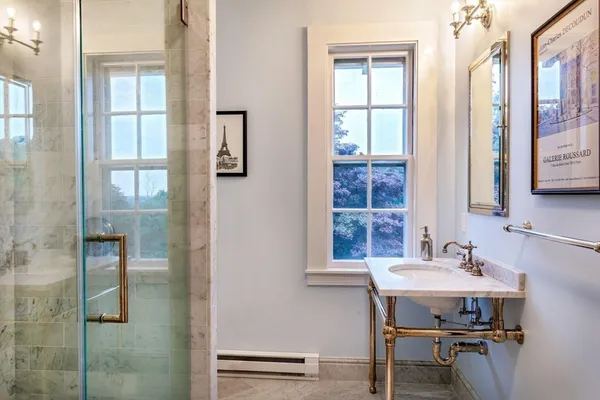 a bathroom with a sink and a mirror