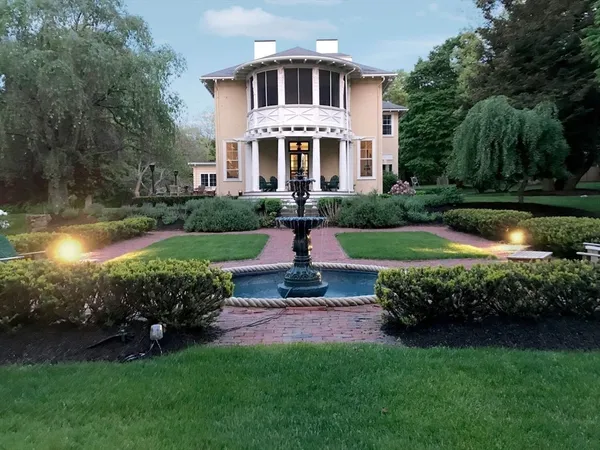 a front view of a house with a yard