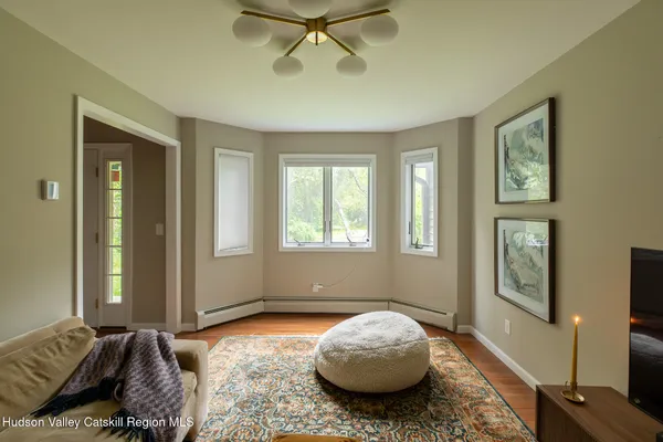 a bedroom with bed and a window