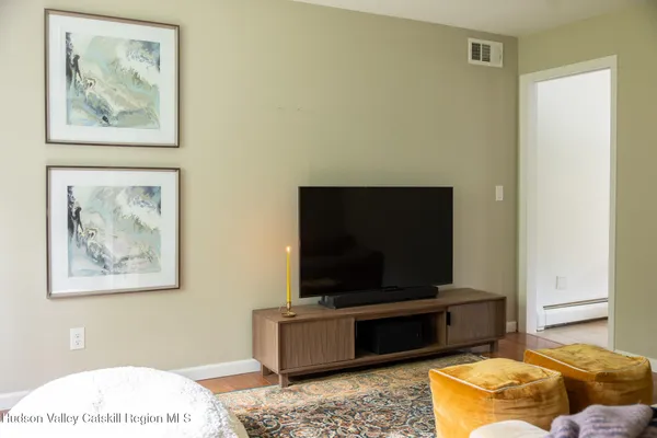 a living room with a couch and a flat screen tv