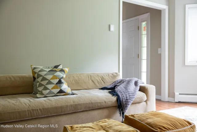 a living room with a couch and a window